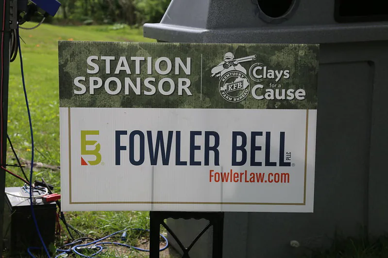 A small sign that says "Fowler Bell", "Station Sponsor", and "Clays Cause".
